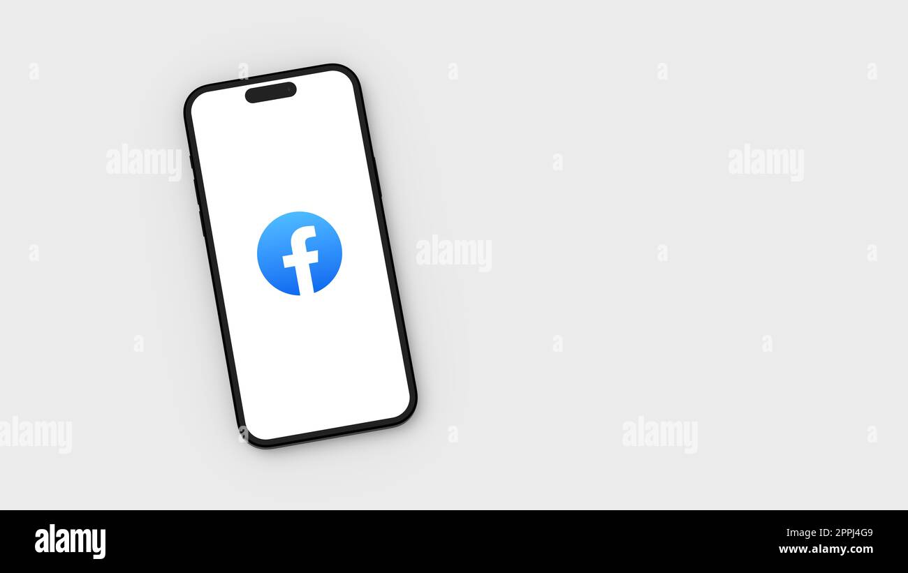Logo Facebook sur l'écran du smartphone sur fond gris clair avec espace de copie Banque D'Images