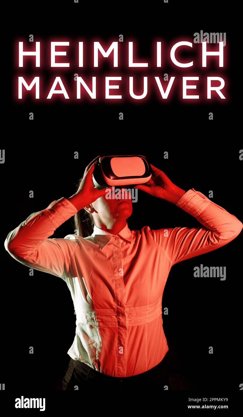 Signe écrit main Heimlich manœuvre. Application photo conceptuelle de la pression ascendante en cas d'étouffement Banque D'Images