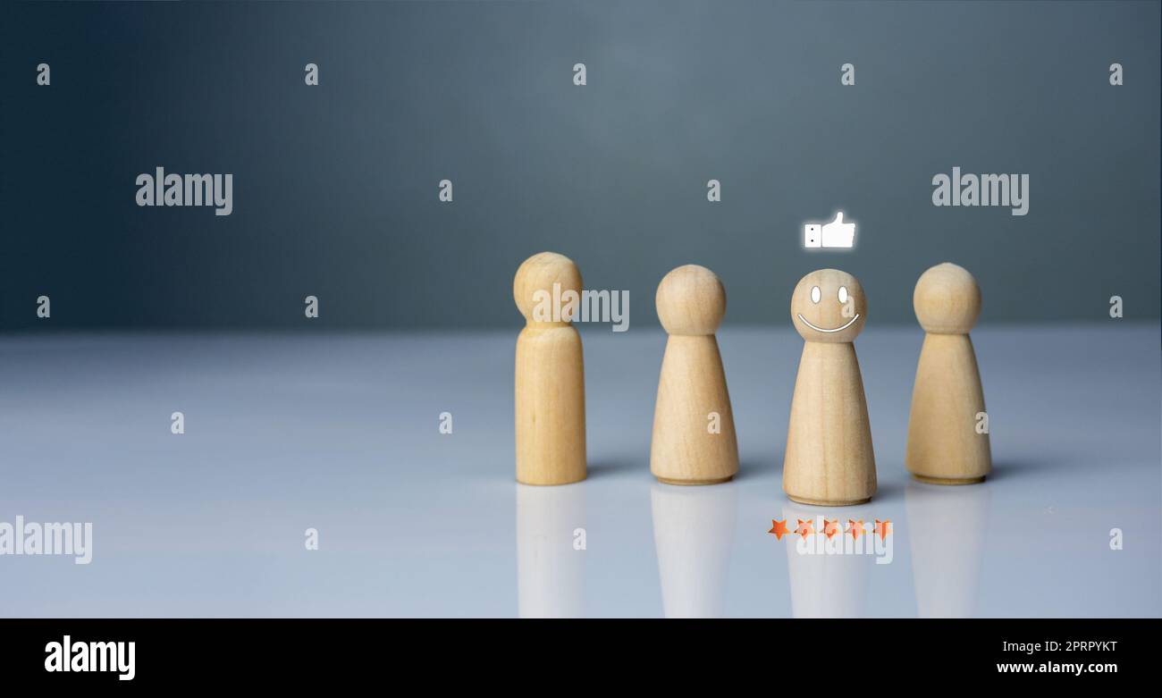 Concept de leadership, diriger, inspirer, responsabiliser, affaires, manager, travail d'équipe, vision, stratégie, influence, concurrence. Poupée en bois dirigeant l'équipe Banque D'Images