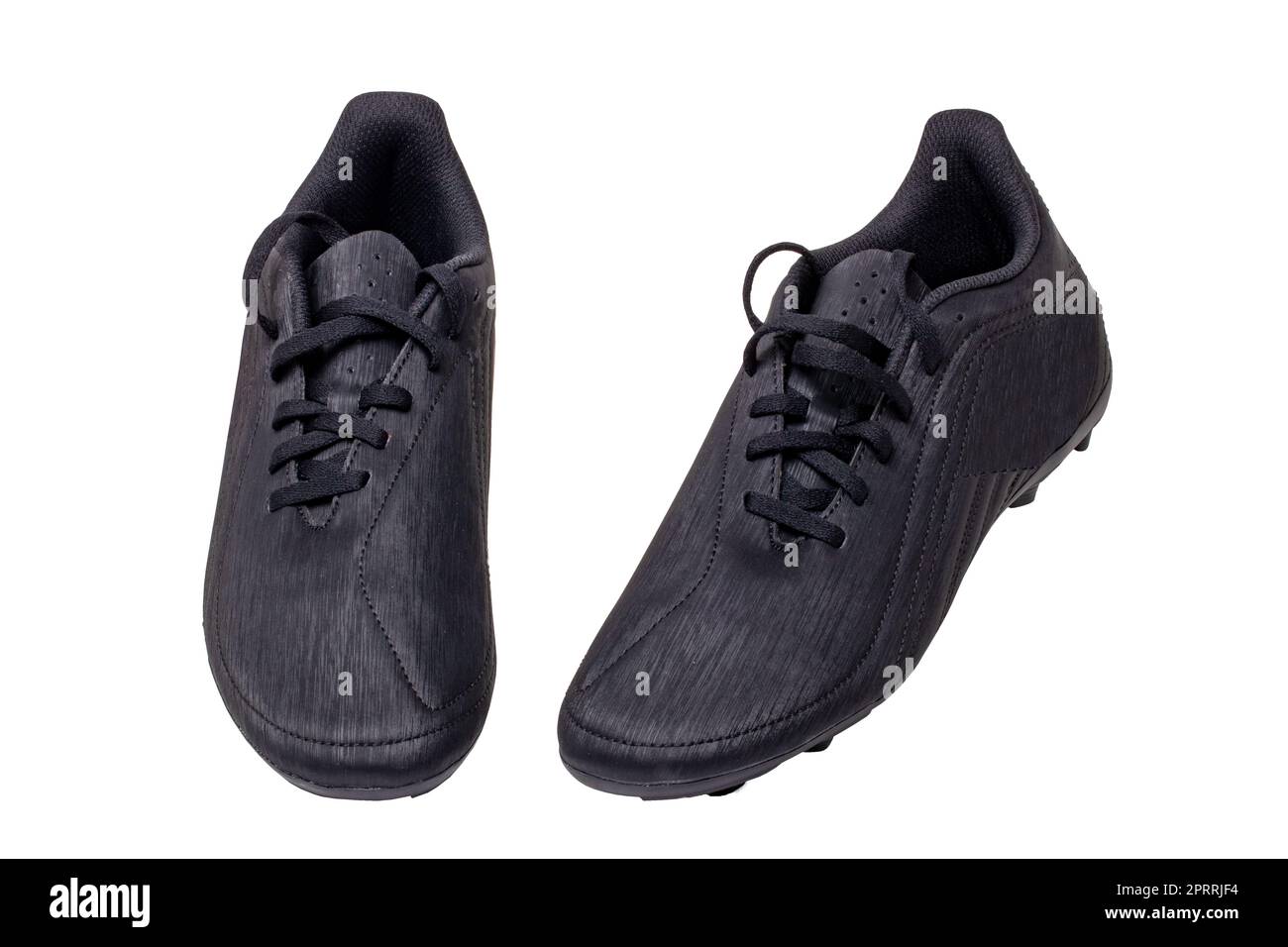 Gros plan d'une paire de chaussures de football en cuir noir isolées sur fond blanc. Chaussures de sport professionnelles pour garçons. Chaussures de sport. Banque D'Images