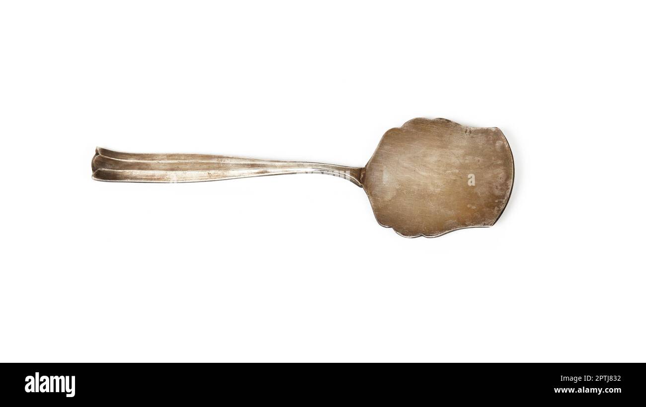 Spatule à gâteau isolée sur fond blanc. Outil de cuisine antique Banque D'Images