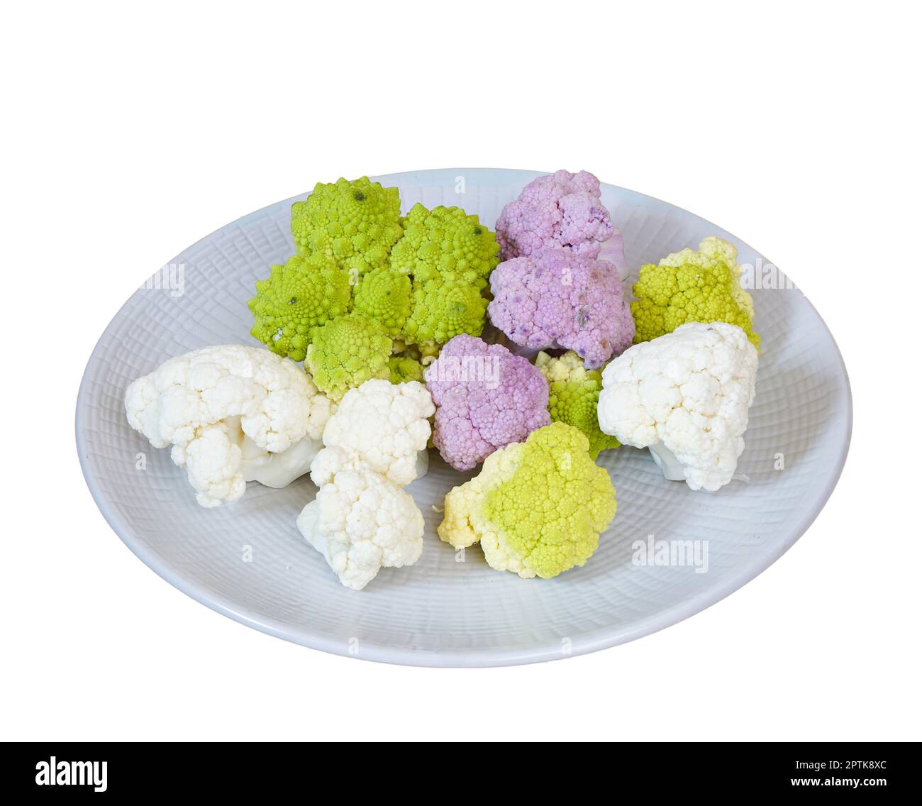 Blanc, rose et vert chou-fleur sur une plaque sur une table en bois Banque D'Images