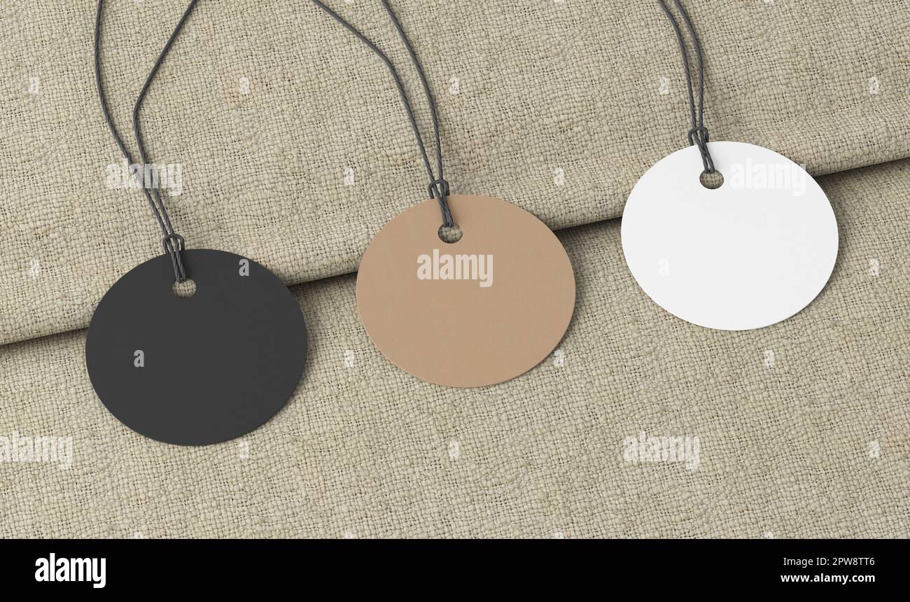 Maquette d'étiquettes rondes blanches, en carton, noires sur fond de tissu. Vue latérale Banque D'Images
