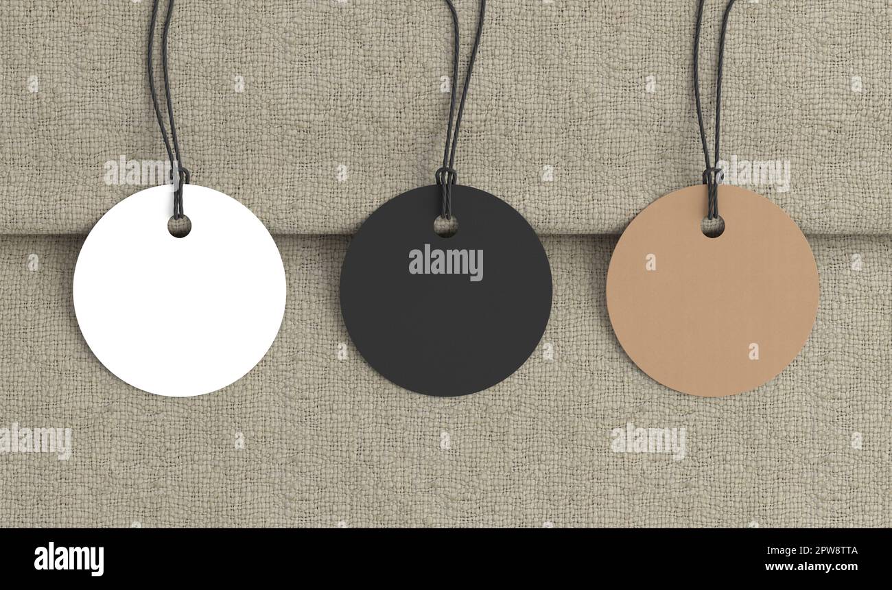 Maquette d'étiquettes rondes blanches, en carton, noires sur fond de tissu. Voir directement au-dessus Banque D'Images