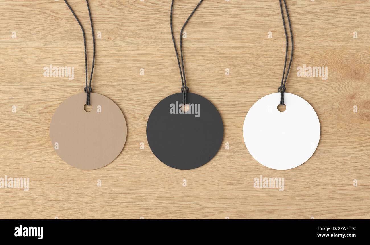 Maquette d'étiquettes rondes blanches, en carton, noires sur fond en bois. Voir directement au-dessus Banque D'Images