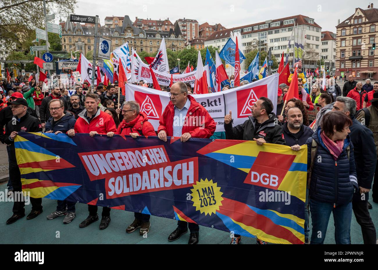 People take part in a Labor Day rally in Stuttgart, Germany, Monday, May 1, 2023. This year, the events of the German Federation of Trade Unions on Labor Day were held under the motto 'Unbroken Solidarity'. (Christoph Schmidt/dpa via AP) Banque D'Images