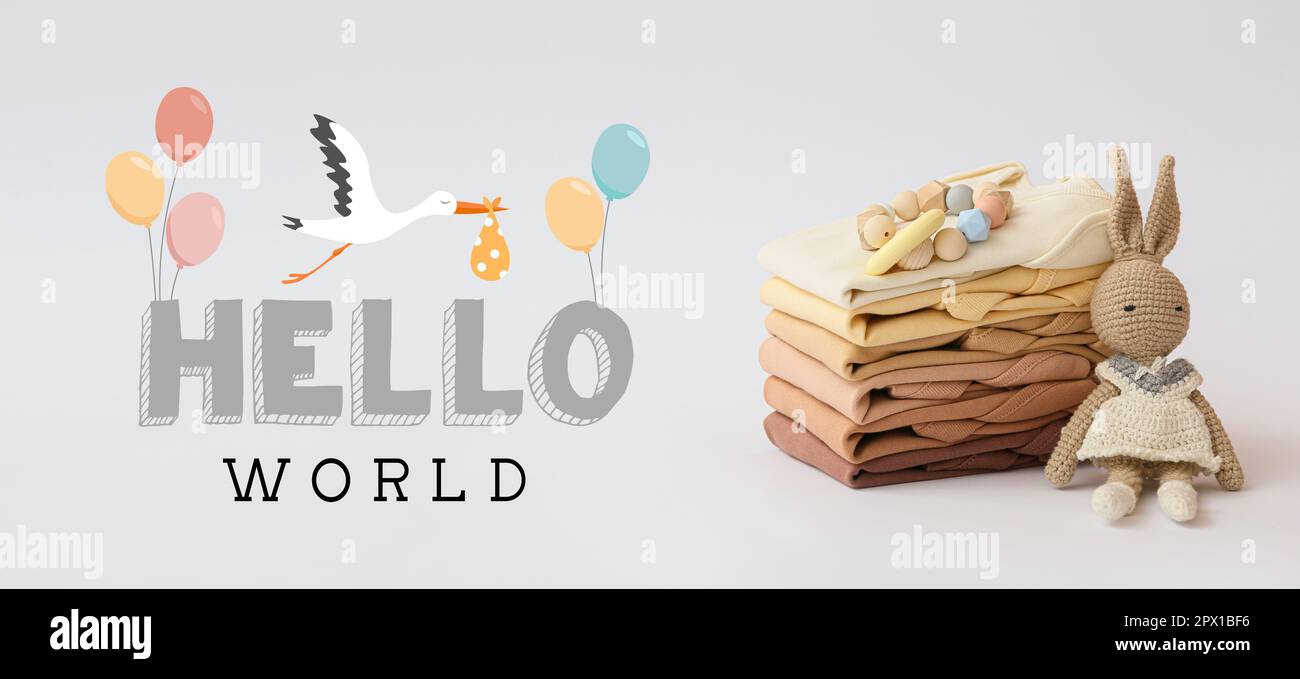Bannière avec texte HELLO WORLD, vêtements et jouets pour bébés Banque D'Images