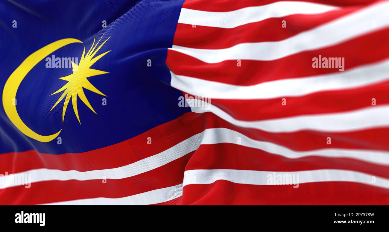 Détail du drapeau national de la Malaisie qui agite dans le vent. La Malaisie est un État fédéral en Asie du Sud-est. Tissu ondulé. Arrière-plan texturé. Réaliste Banque D'Images