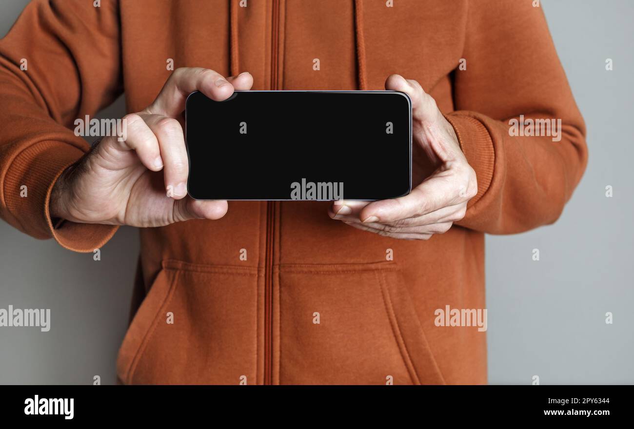 Smartphone entre les mains des hommes Banque D'Images