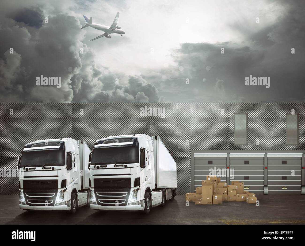 Camions blancs dans la piste d'un port d'échange prêt à charger les marchandises et à atteindre les destinations. Concept logistique de transport international Banque D'Images