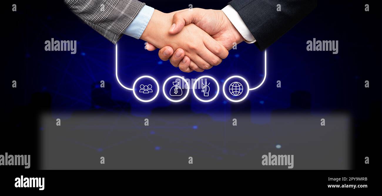 Poignée de main présentant des idées de plan innovantes symbolisant le succès du travail d'équipe accompli. Les paumes de bienvenue affichent un effort combiné pour accomplir des stratégies de projet. Banque D'Images