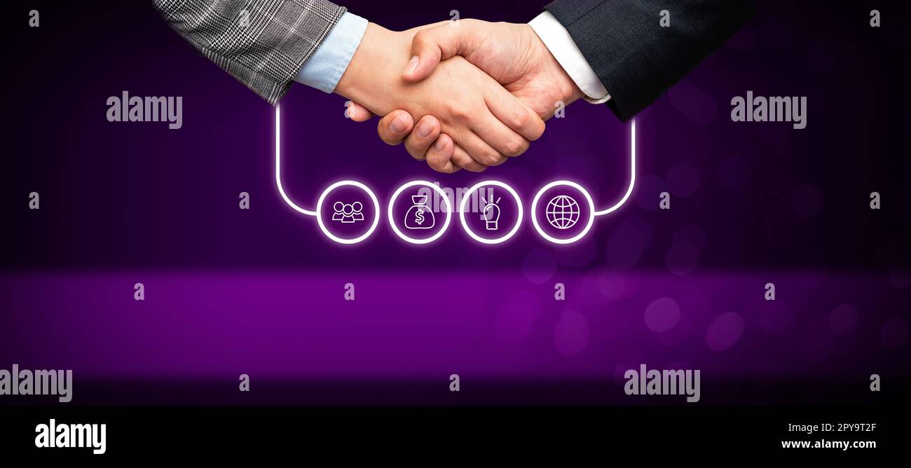 Poignée de main présentant des idées de plan innovantes symbolisant le succès du travail d'équipe accompli. Les paumes de bienvenue affichent un effort combiné pour accomplir des stratégies de projet. Banque D'Images