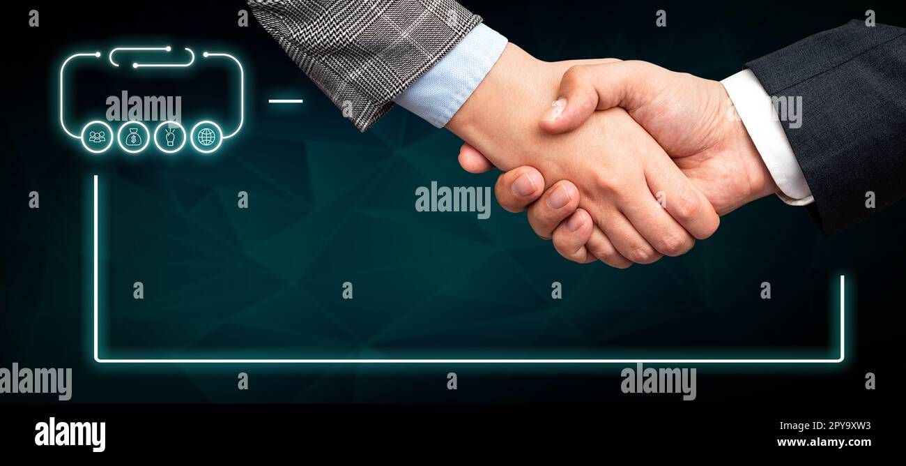 Poignée de main présentant des idées de plan innovantes symbolisant le succès du travail d'équipe accompli. Les paumes de bienvenue affichent un effort combiné pour accomplir des stratégies de projet. Banque D'Images