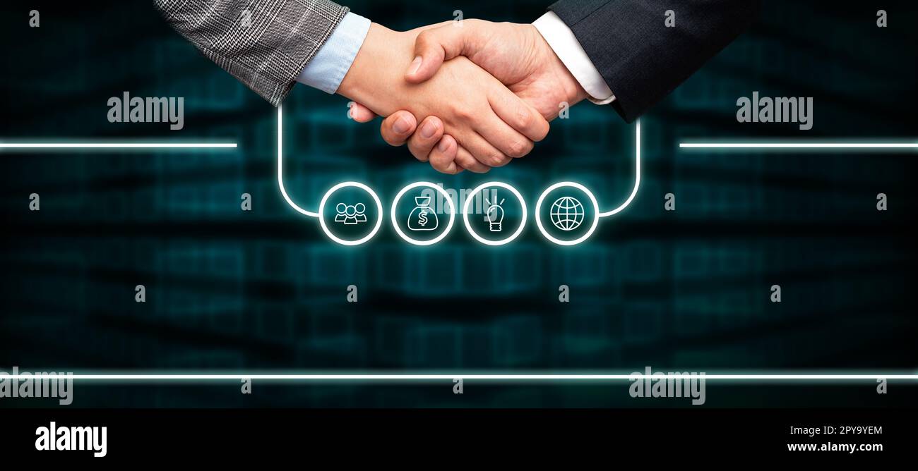 Poignée de main présentant des idées de plan innovantes symbolisant le succès du travail d'équipe accompli. Les paumes de bienvenue affichent un effort combiné pour accomplir des stratégies de projet. Banque D'Images