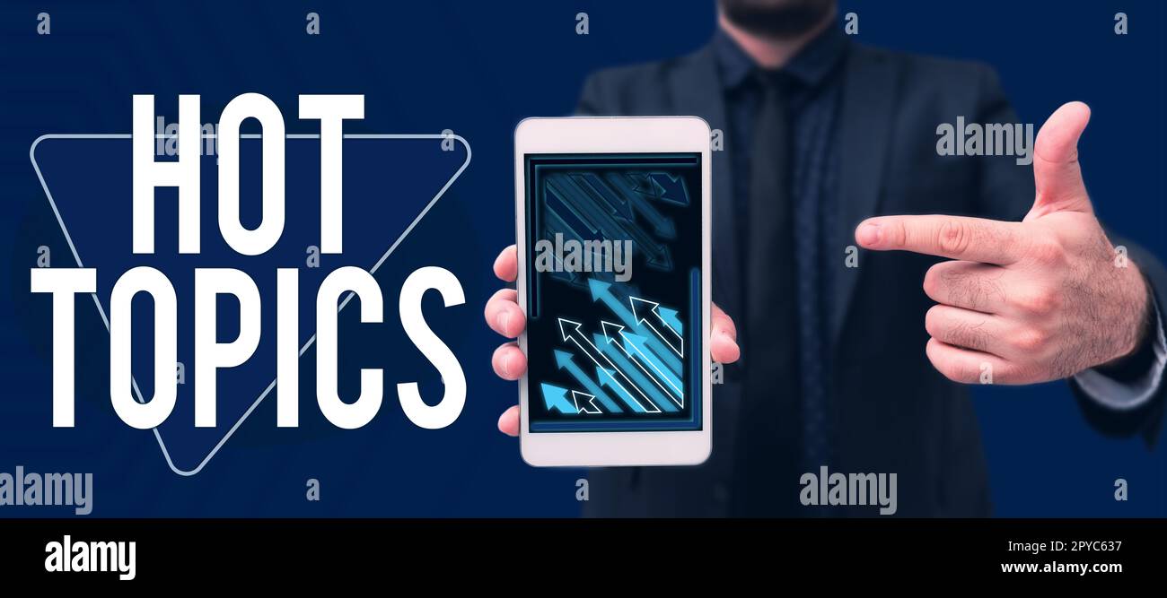 Écriture affichage de texte Hot Topics. Mot pour sujet que beaucoup de gens sont en discussion et en discussion Banque D'Images