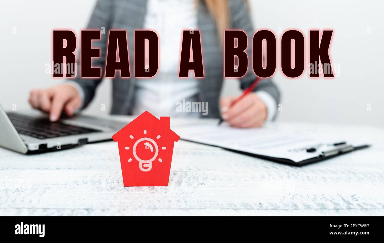 Panneau de texte indiquant Lire Un livre. Idée d'affaires Profitez de la littérature activité traditionnelle Apprenez de nouvelles choses Banque D'Images