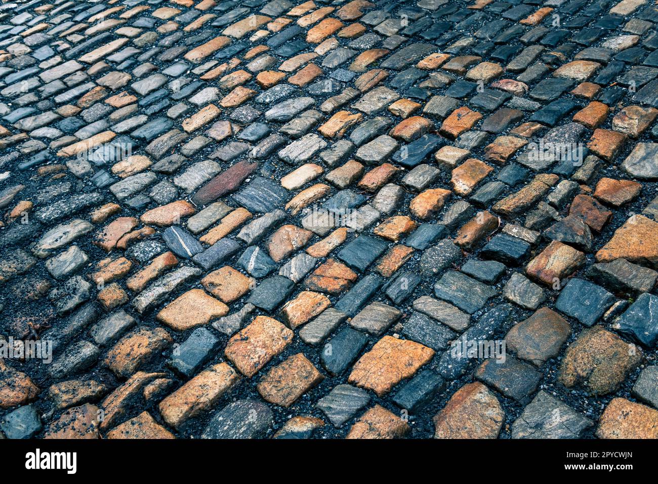 Le trottoir de pierre de granit. Rue pavée, texture, fond Banque D'Images