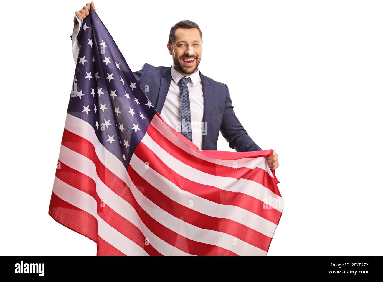 Joyeux jeune homme professionnel portant un drapeau américain isolé sur fond blanc Banque D'Images