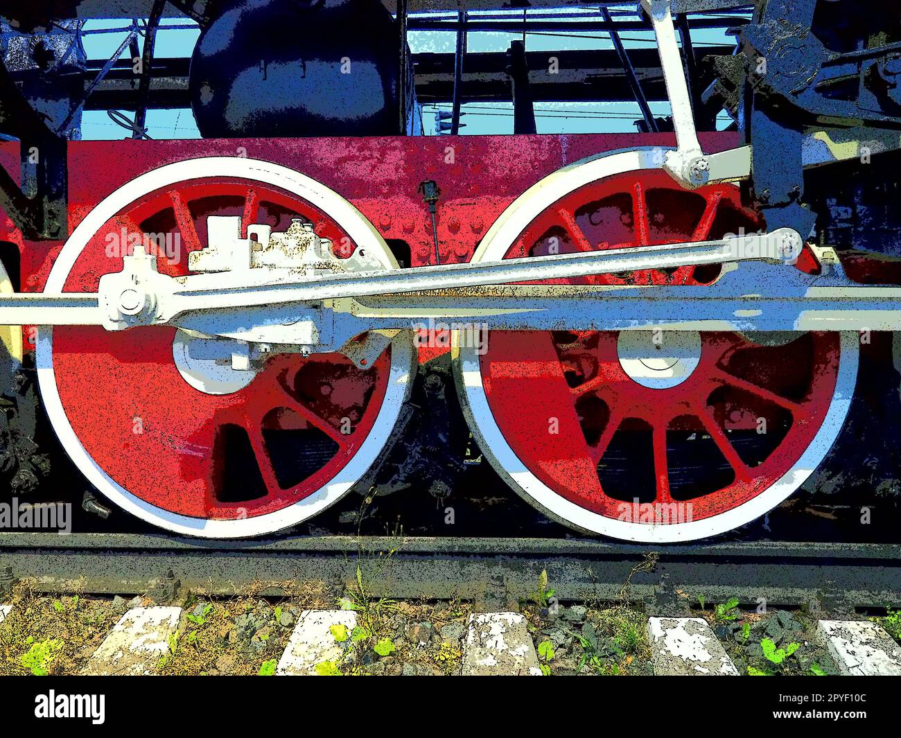 Roues rétro vintage d'une locomotive ou d'un train en gros plan. Grandes roues rouges en métal lourd avec mécanismes de guidage de piston. Locomotive des 19e - 20e siècles avec une machine à vapeur. Photo éclatante et éclatante Banque D'Images