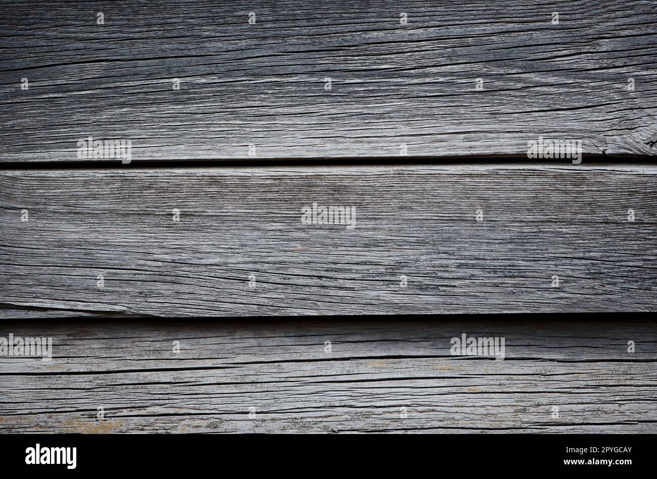 Planches de bois posées les unes à côté des autres. Une texture de bois faite de plusieurs planches de bois. Banque D'Images