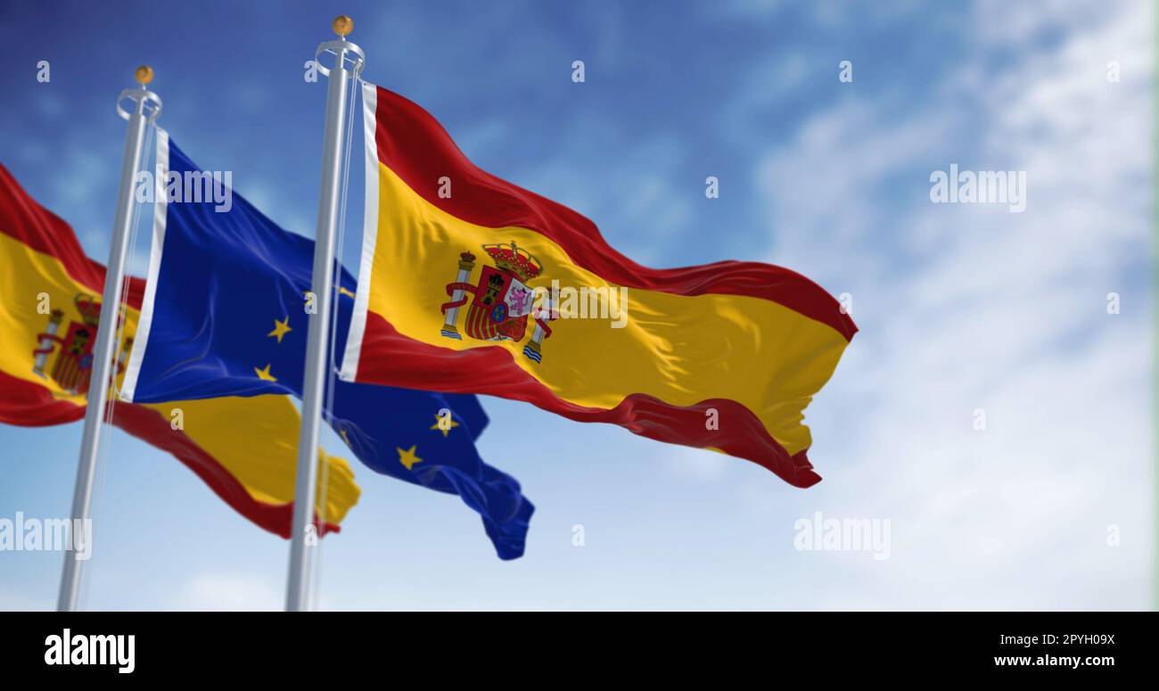 Les drapeaux de l'Espagne et de l'Union européenne agitant dans le vent par une journée ensoleillée. Démocratie et politique. Pays européen. Banque D'Images