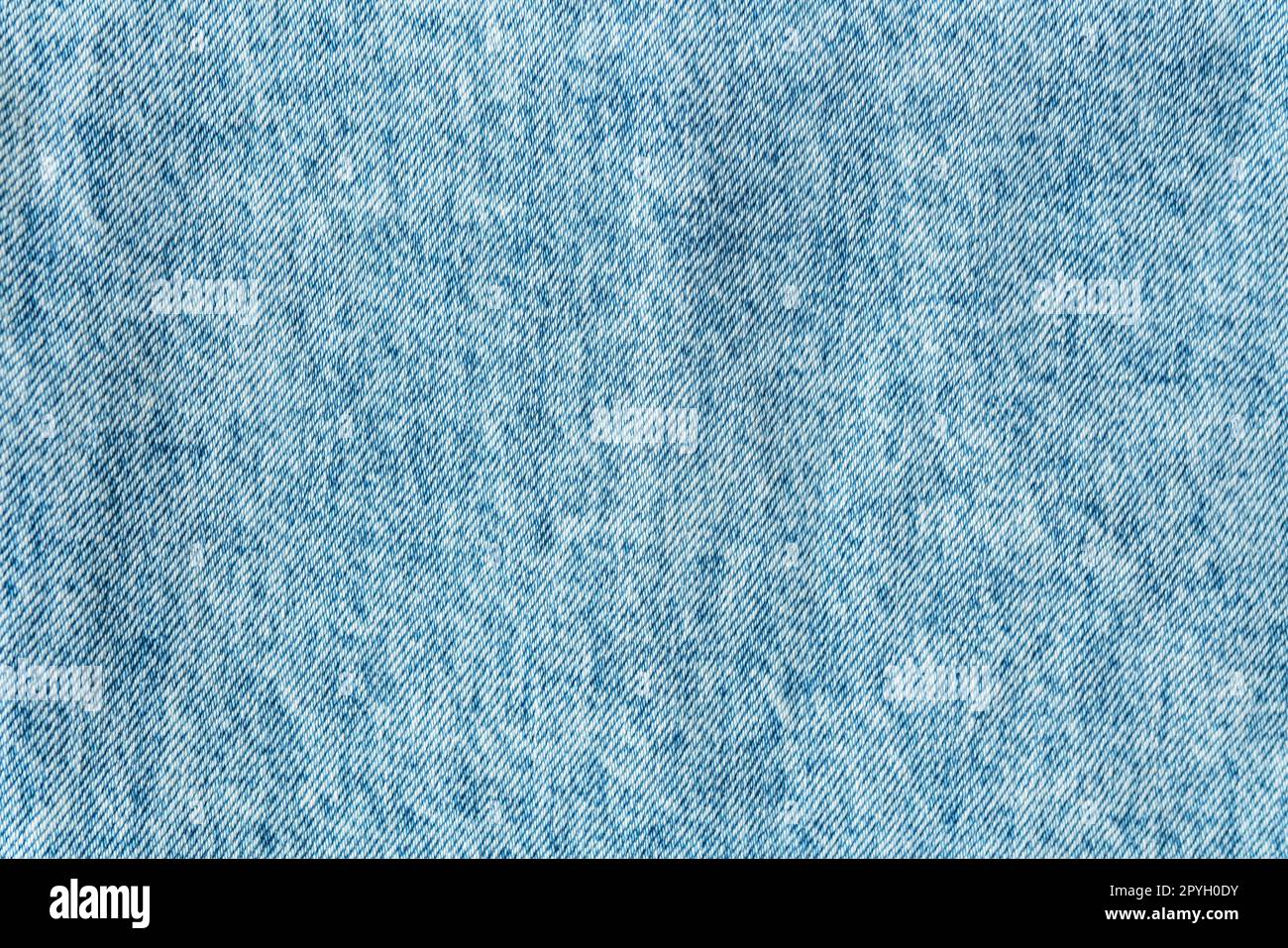 Structure denim, tissu denim bleu classique, structure de tissu claire, place pour le texte. Fond, texture. Mise au point sélective, bruit. Banque D'Images