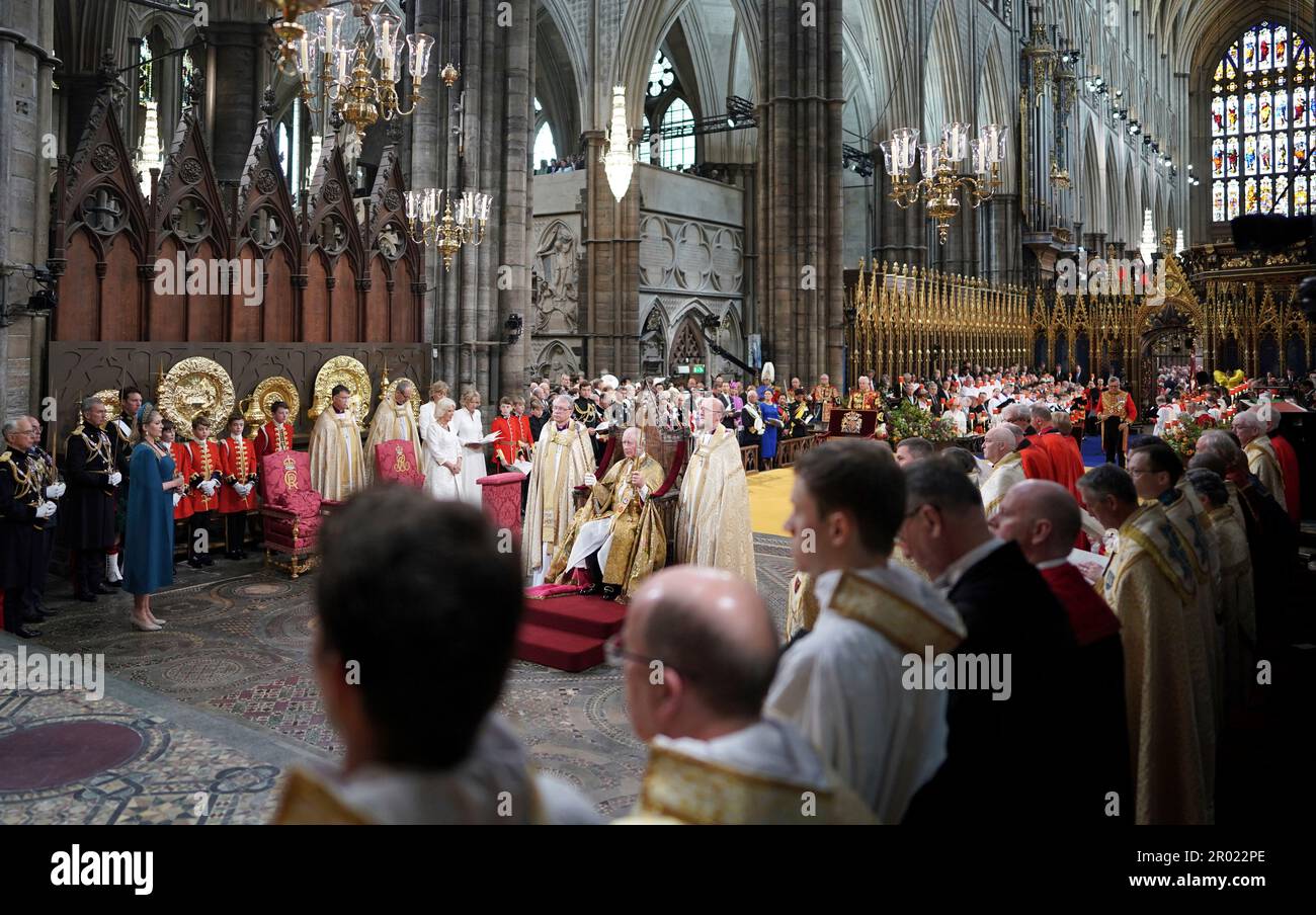 King Charles III sits as he holds The Sovereign's Sceptre with Cross during his coronation ceremony in Westminster Abbey, London, Saturday, May 6, 2023. (Jonathan Brady/Pool Photo via AP) Banque D'Images