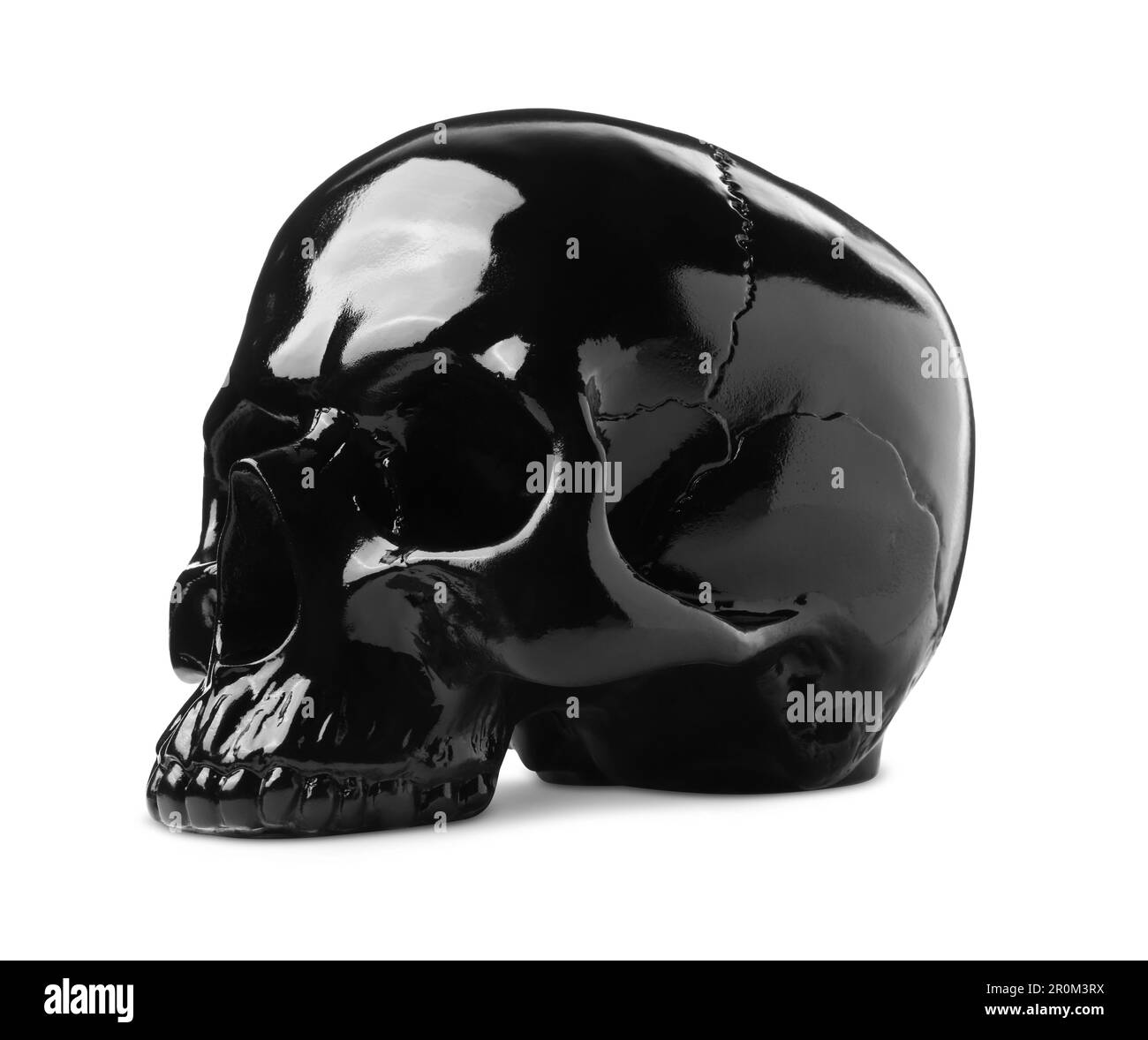 Crâne noir brillant avec dents isolées sur blanc Banque D'Images