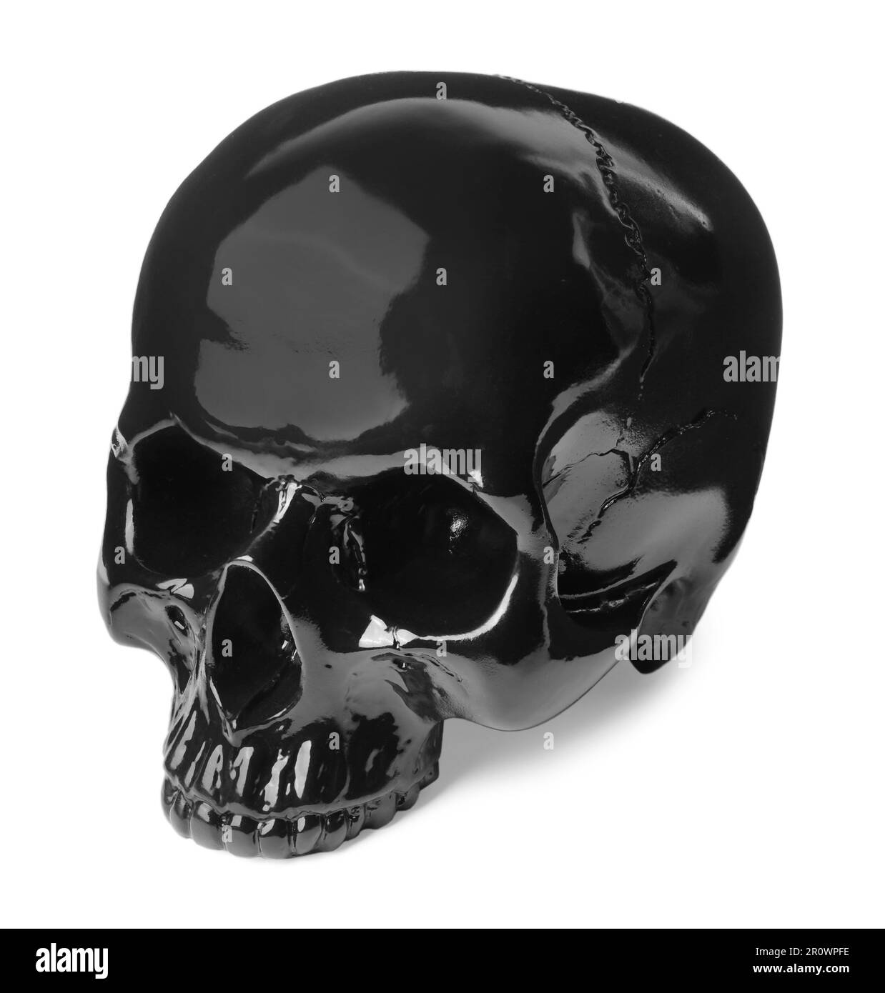 Crâne humain brillant noir isolé sur blanc Banque D'Images
