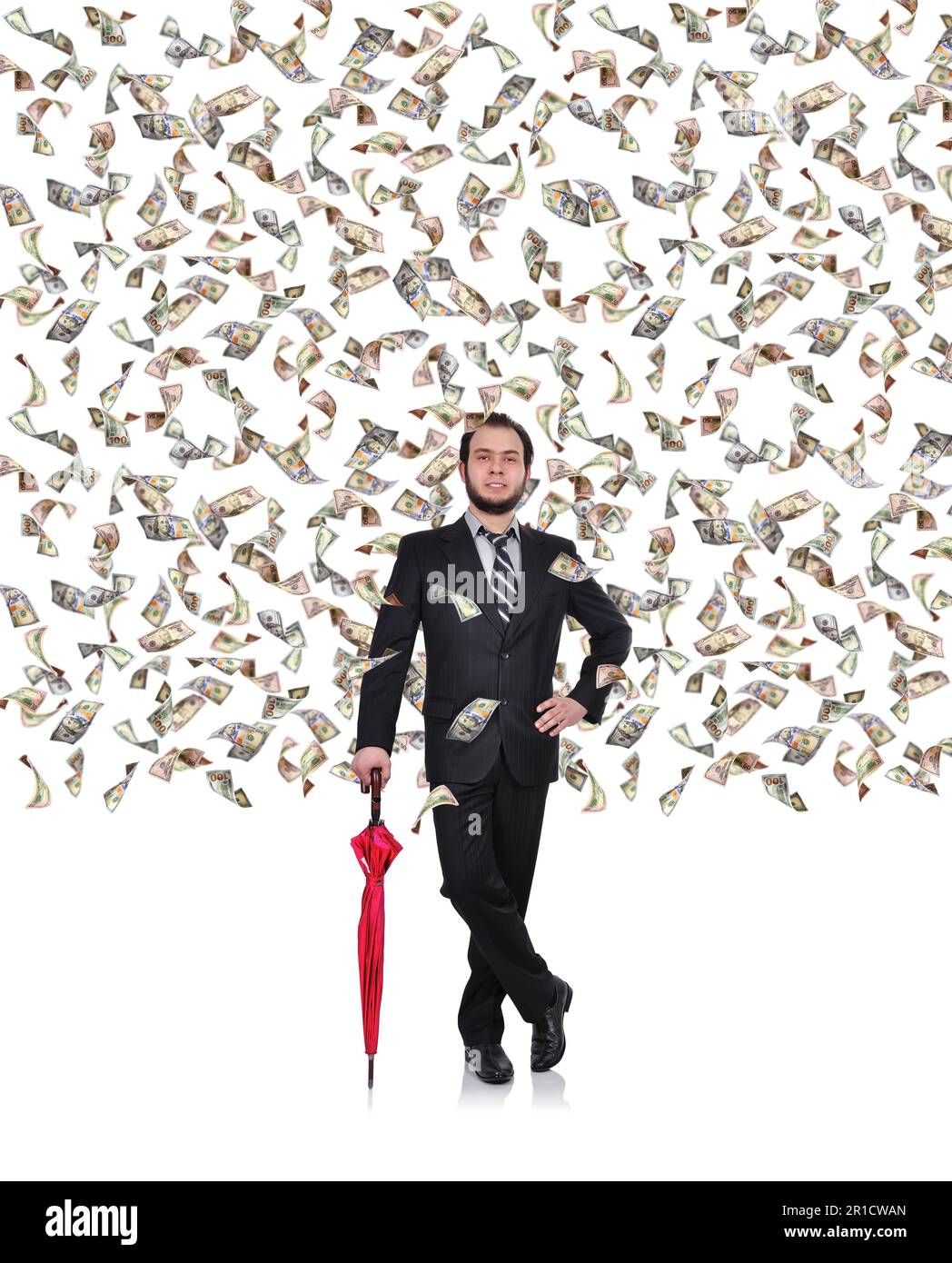 jeune homme d'affaires avec parapluie et billets de vol en dollars Banque D'Images