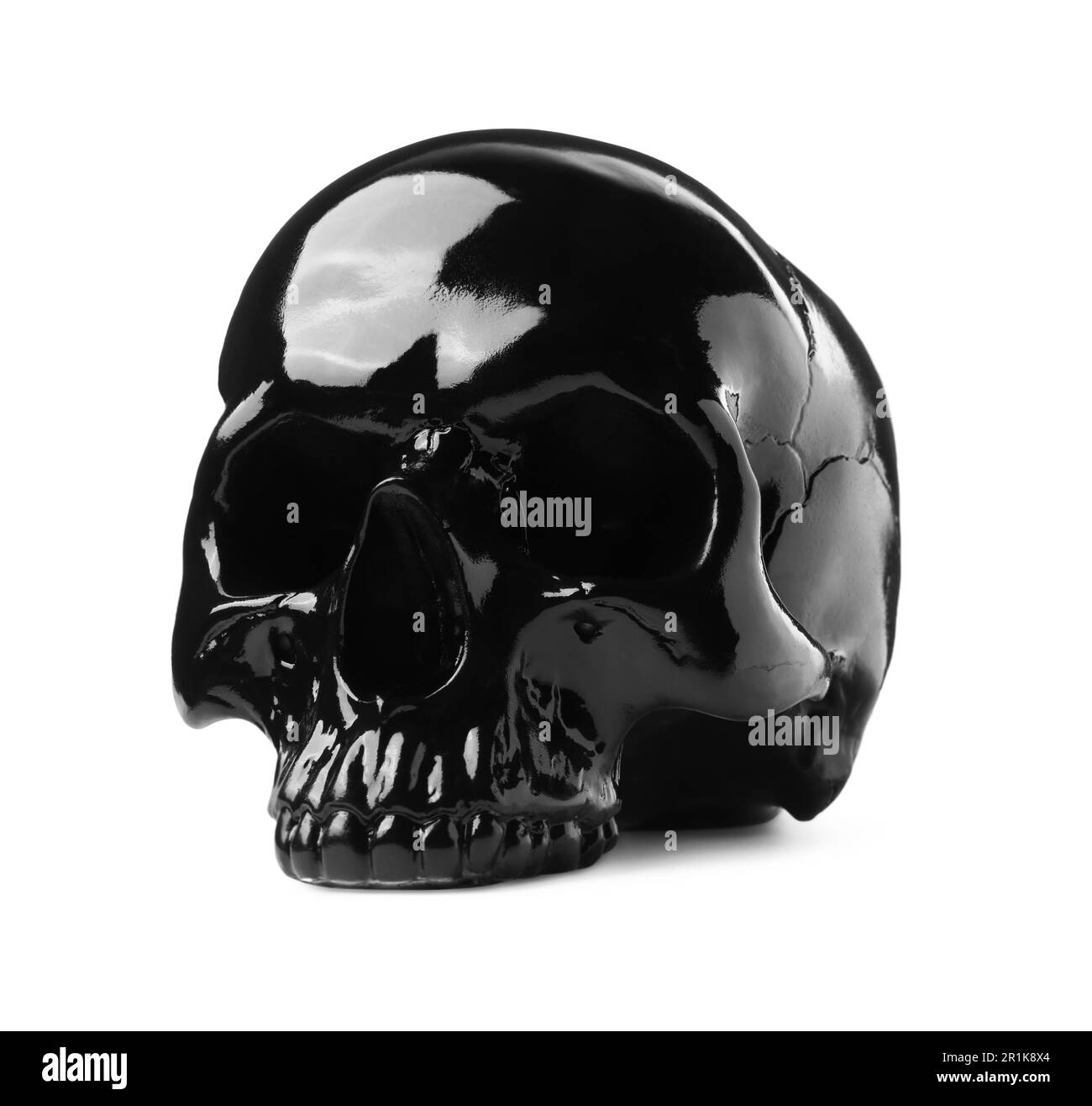 Crâne noir brillant avec dents isolées sur blanc Banque D'Images