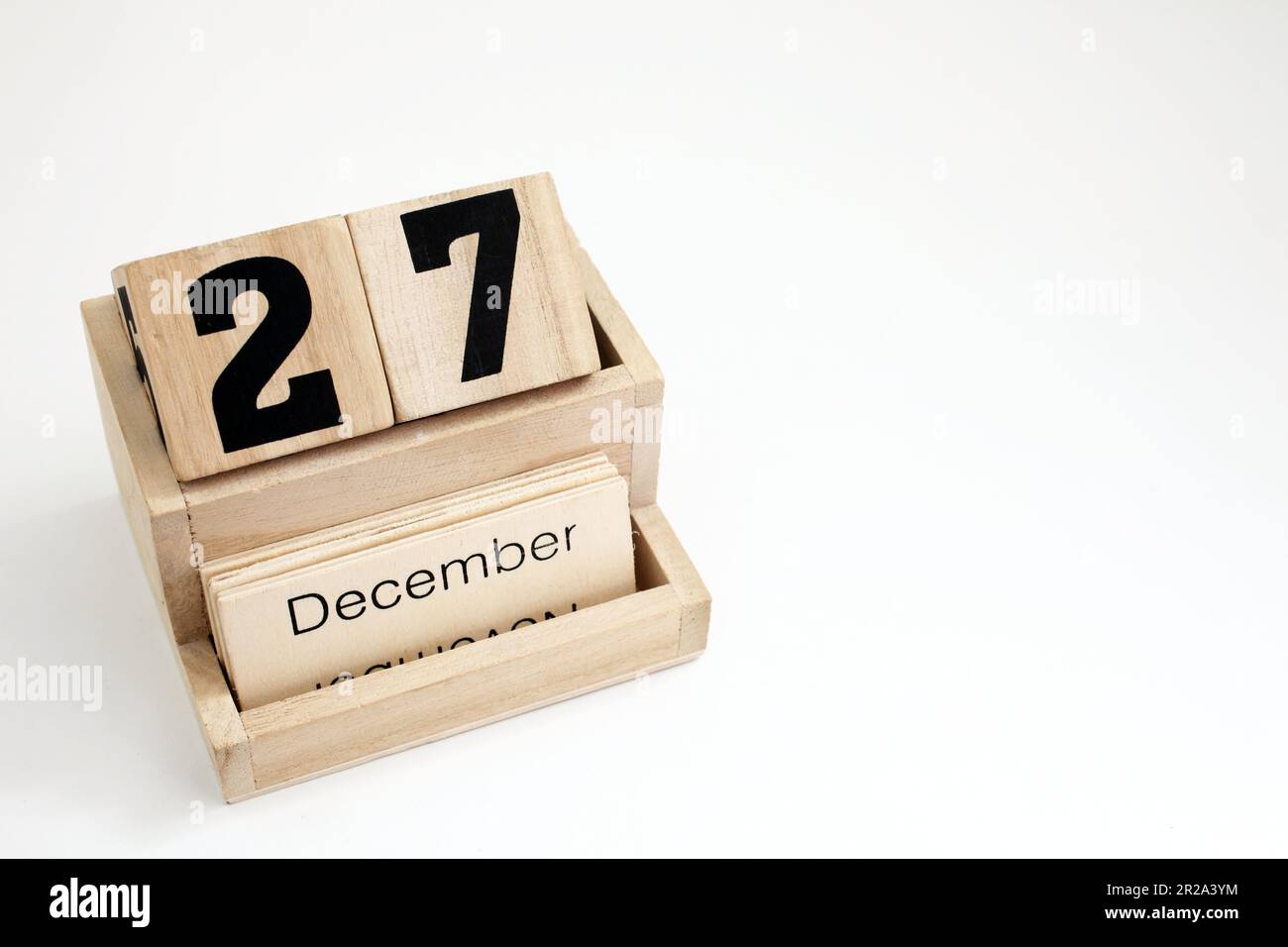 Calendrier perpétuel en bois montrant le 27th décembre Banque D'Images