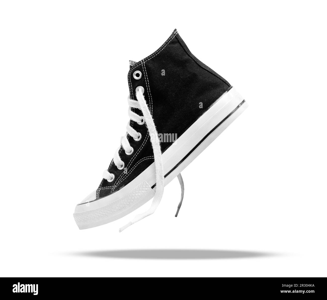 Sneakers noires Chucks taylor isolé sur fond blanc Banque D'Images