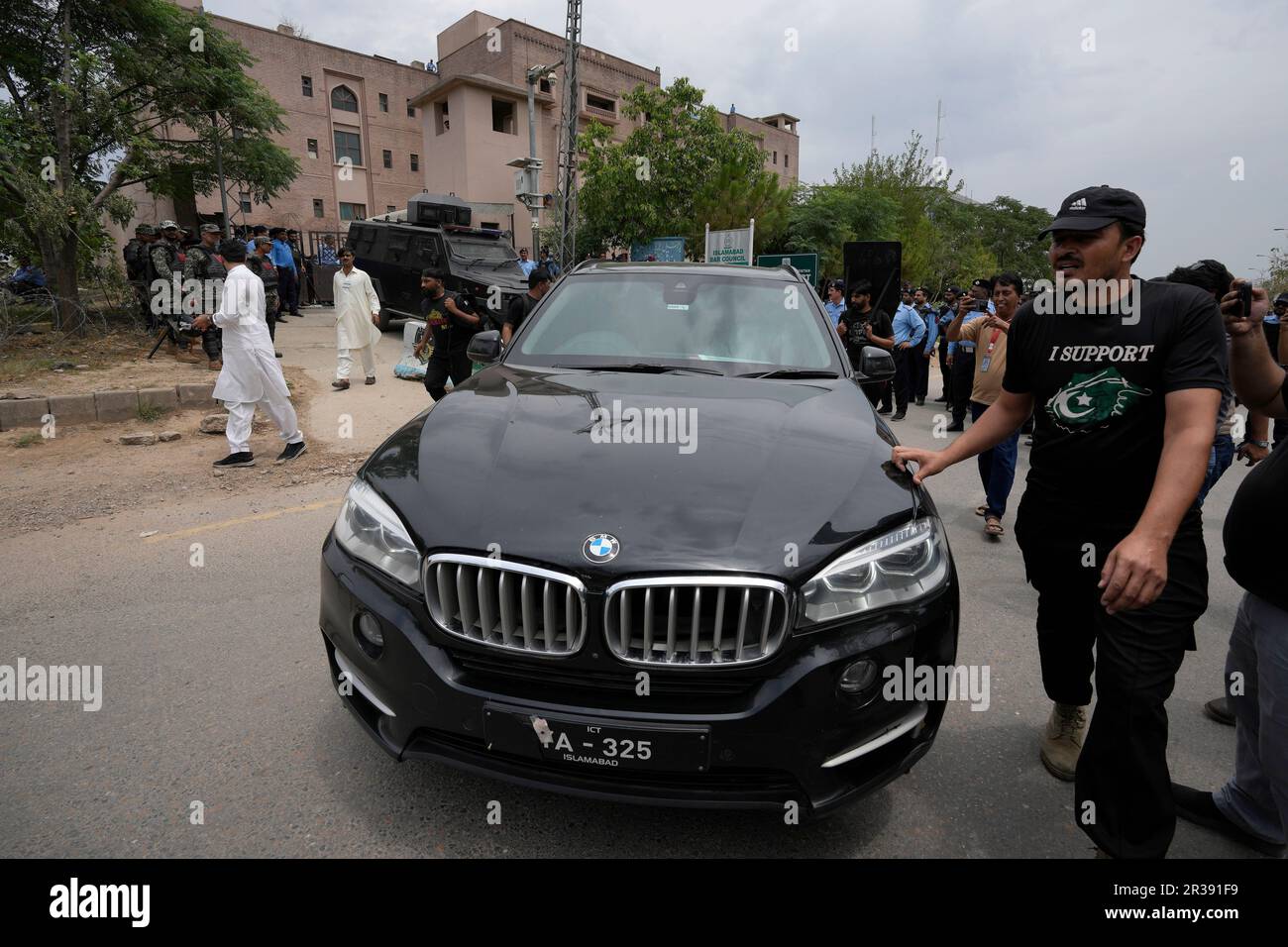 Pakistan. Imran Driver Rj Security personnels clear way for a vehicle carrying the Pakistan's ...