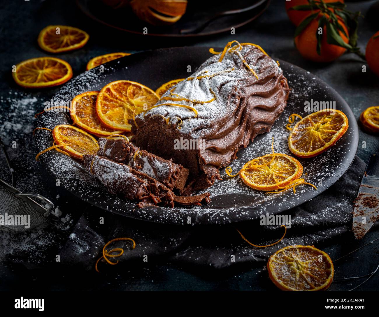 insta Chocolate log avec des notes de zeste d'orange et de sucre glace dépoussiérant Banque D'Images