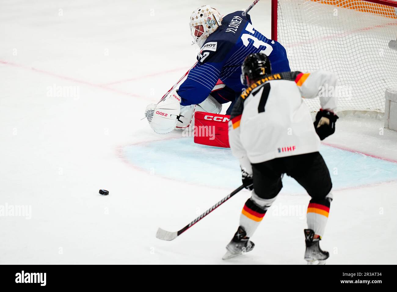 Germany's Maximilian Kastner, right, scores his side's fifth goal past France's goalie Sebastian Ylonen the group A match between Germany and France at the ice hockey world championship in Tampere, Finland, Tuesday, May 23, 2023. (AP Photo/Pavel Golovkin) Banque D'Images