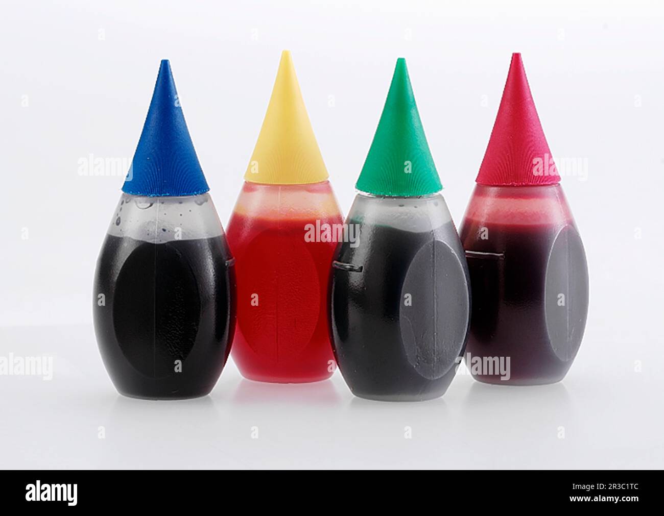 Quatre flacons de colorant alimentaire Banque D'Images