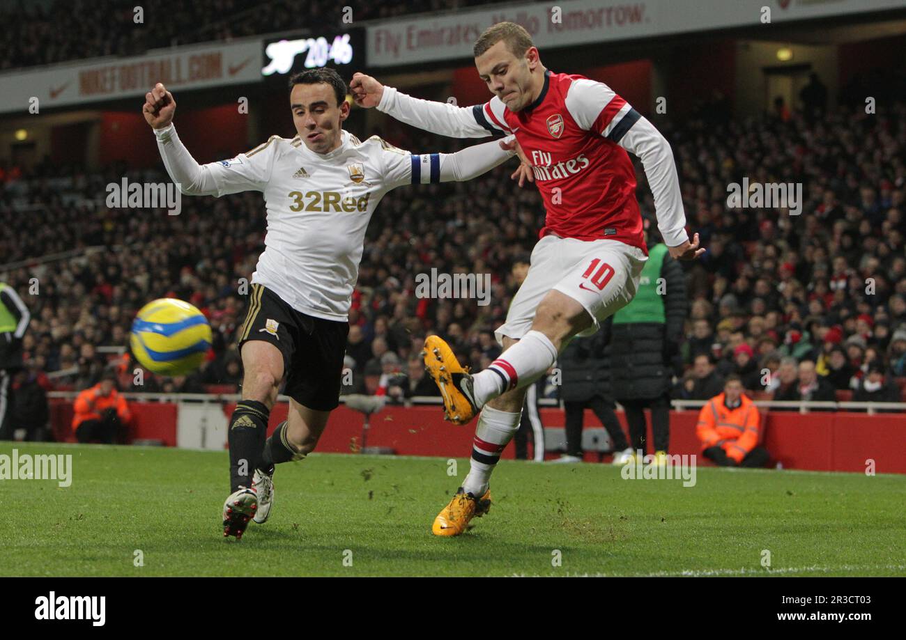 Leon Britton de Swansea City combat avec Jack Wilshere d'Arsenal. Le minerai de sc est 0:0Arsenal 16/01/13 Arsenal V Swansea City 16/01/13 la coupe FA troisième Banque D'Images