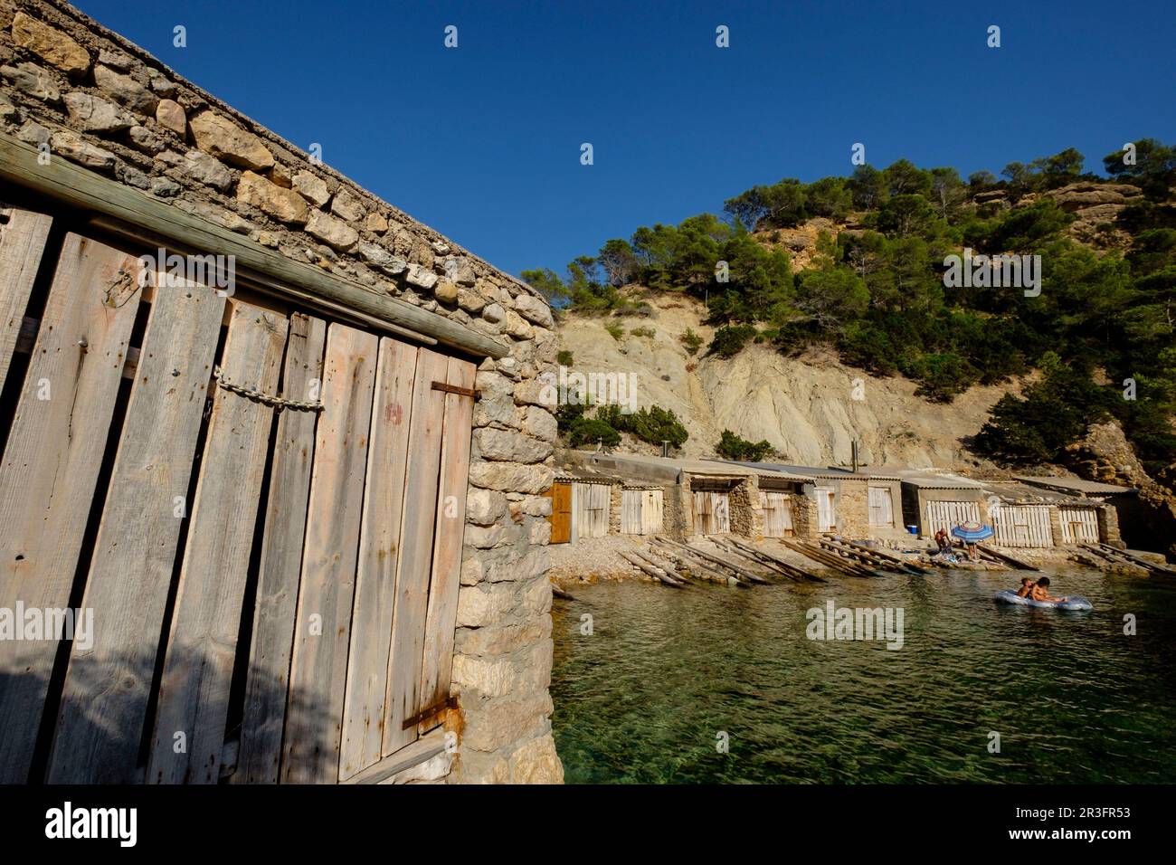 Casetas de varadero, Es Portitxol, Municipio de Sant Joan de LabritjaIbiza, Iles Baléares, Espagne. Banque D'Images