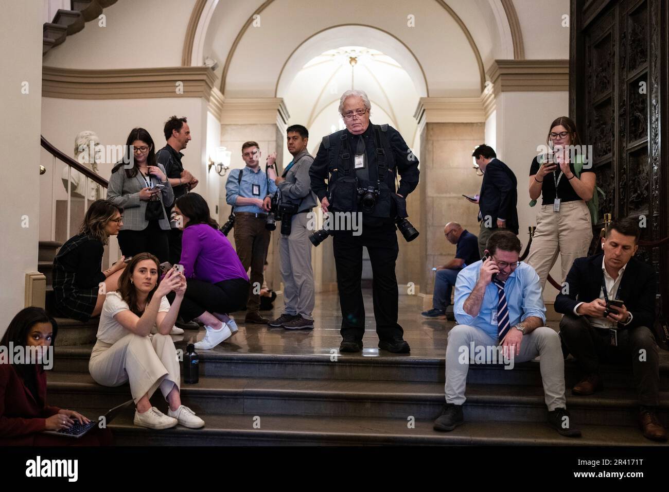 UNITED STATES - MAY 23: J. Scott Applewhite, center, of the Associated Press,  and members of the media wait for the arrival of Speaker of the House Kevin  McCarthy, R-Calif., in the