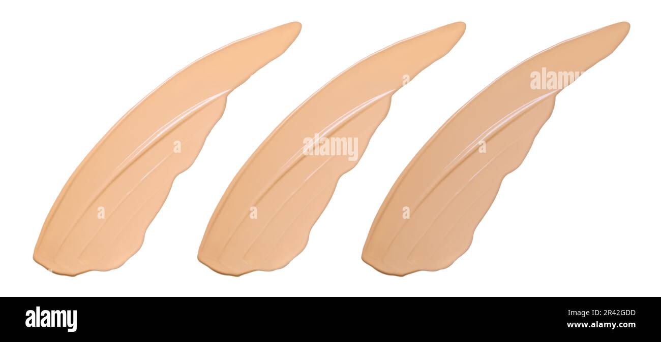Échantillons de fond de teint de face isolés sur blanc. Couleurs naturelles produits cosmétiques formes de pinceau nuances Banque D'Images