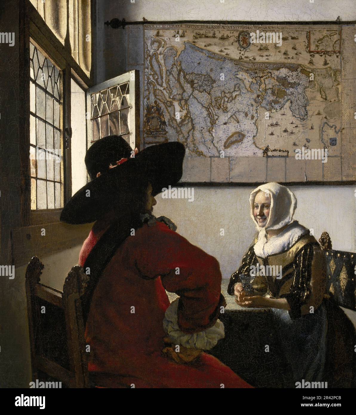 Soldat et fille en riant peint par le peintre néerlandais de l'âge d'or Johannes Vermeer en 1657 Banque D'Images