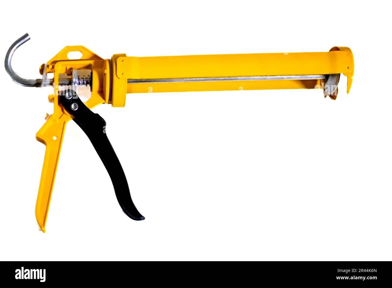 Image d'un pistolet à colle jaune isolé sur fond blanc Banque D'Images