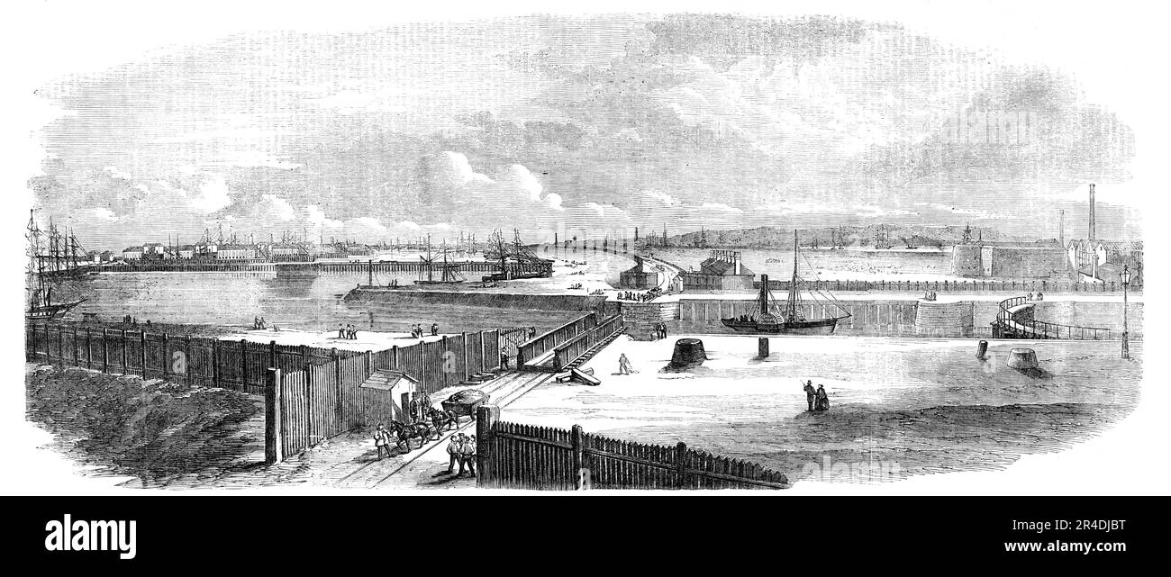 Victoria Docks - vue générale, 1856. 'L'ensemble du côté sud du quai, qui comprend près d'un mille de façade d'eau, sera consacré à l'hébergement du bois et d'autres métiers nécessitant de l'espace. Toutes les grues, les cabestans, les portes de verrouillage et les étaux seront alimentés par la puissance hydraulique. Le bassin de marée [Thames] sera accessible de nuit comme de jour pour les bateaux à vapeur et autres navires nécessitant une expédition... des trains réguliers circulent tout au long de la journée entre la gare Fenchurch-Street et les quais... les messages seront transmis par électricité telegraph...free de charge... ces quais seront Banque D'Images