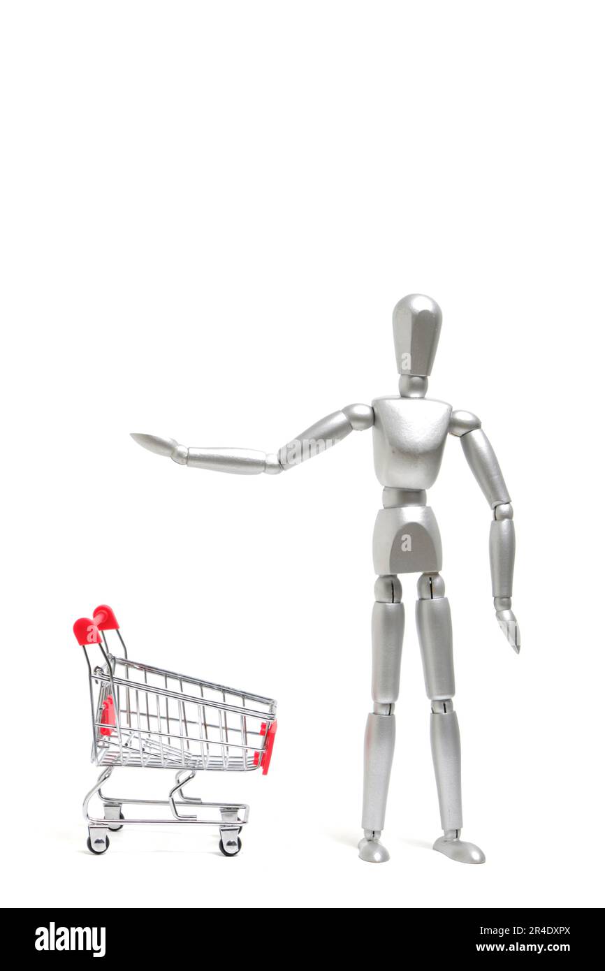 Mannequins blancs dans le panier avant.concept allant au supermarché et au magasin Banque D'Images