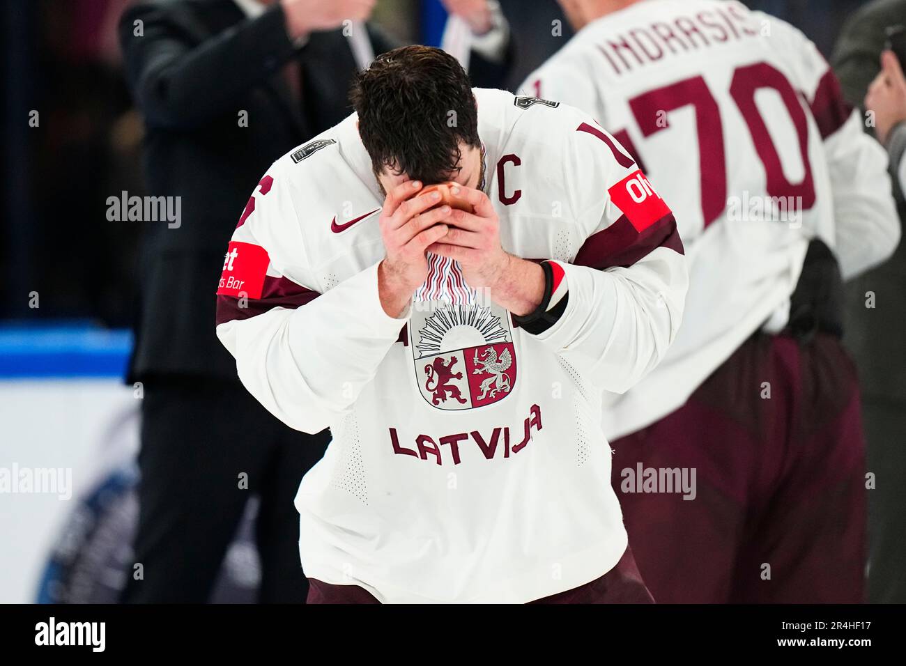 Latvia's Kaspars Daugavins (16) reacts during the medal ceremony after their overtime win against the United States in the bronze medal match at the Ice Hockey World Championship in Tampere, Finland, Sunday, May 28, 2023. Latvia won 4-3. (AP Photo/Pavel Golovkin) Banque D'Images