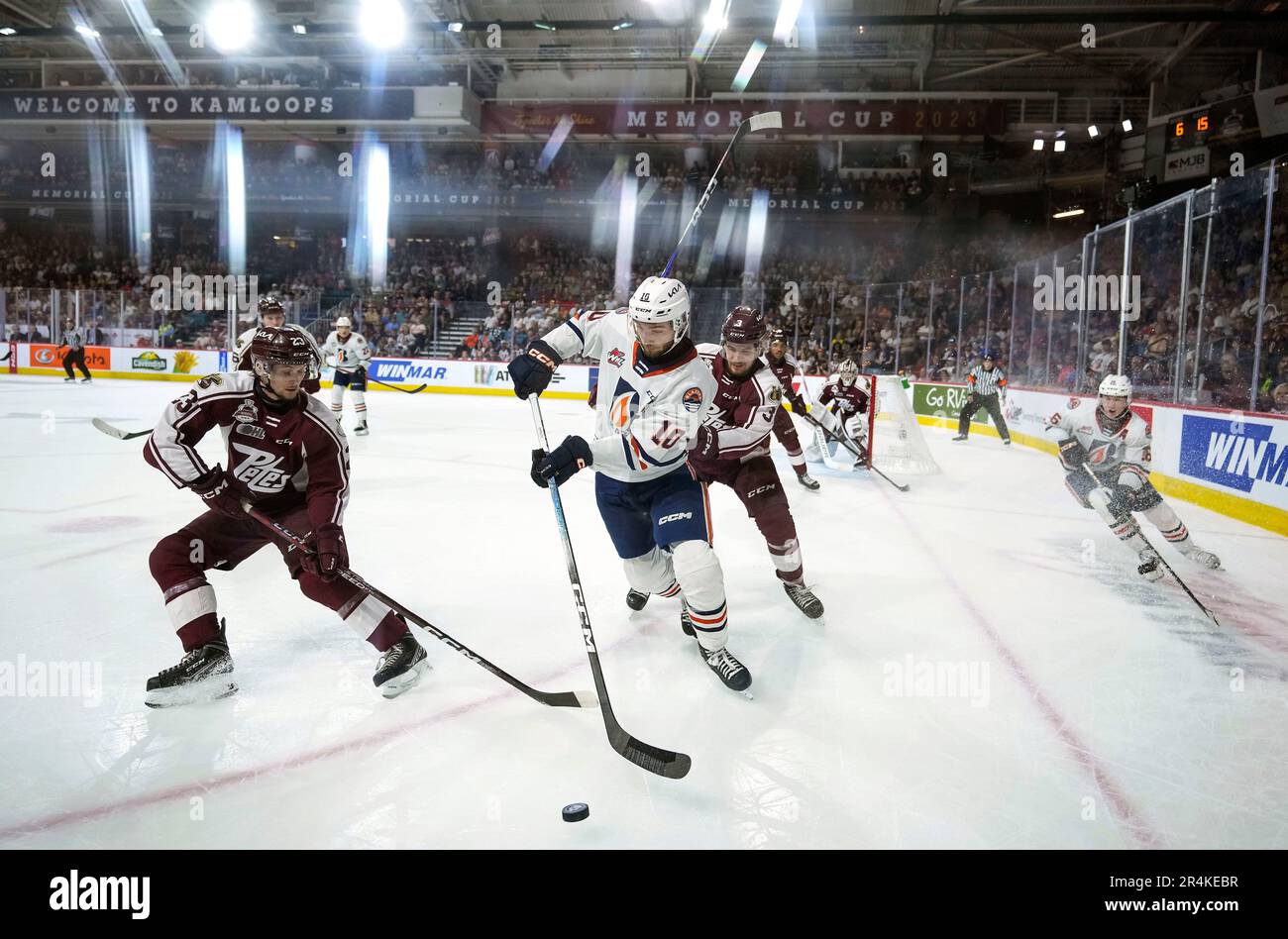 Kamloops Blazers' Ryan Hofer (10) vies for the puck against