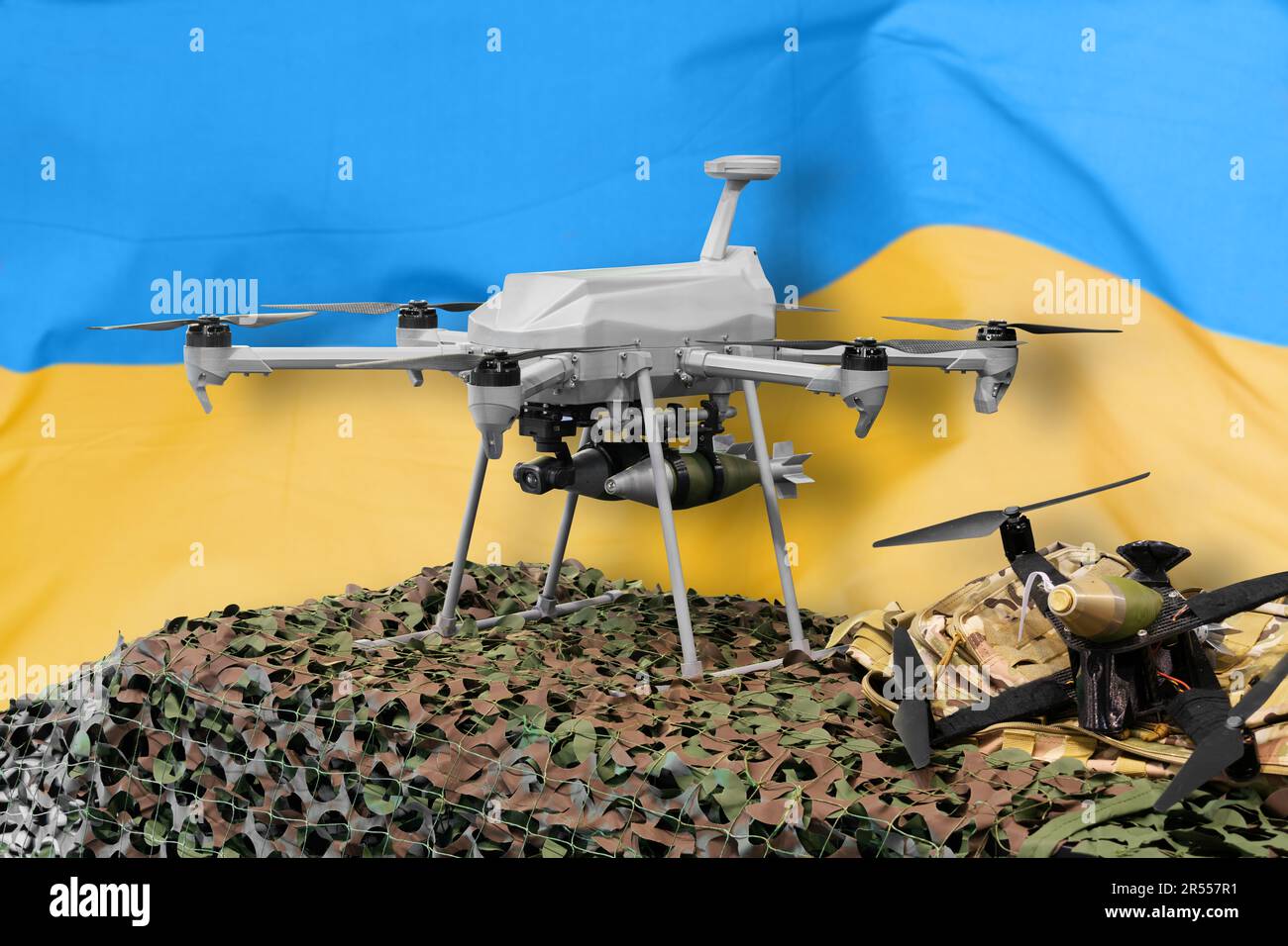 Des drones militaires armés de bombes sur fond de drapeau ukrainien. Photo de haute qualité Banque D'Images