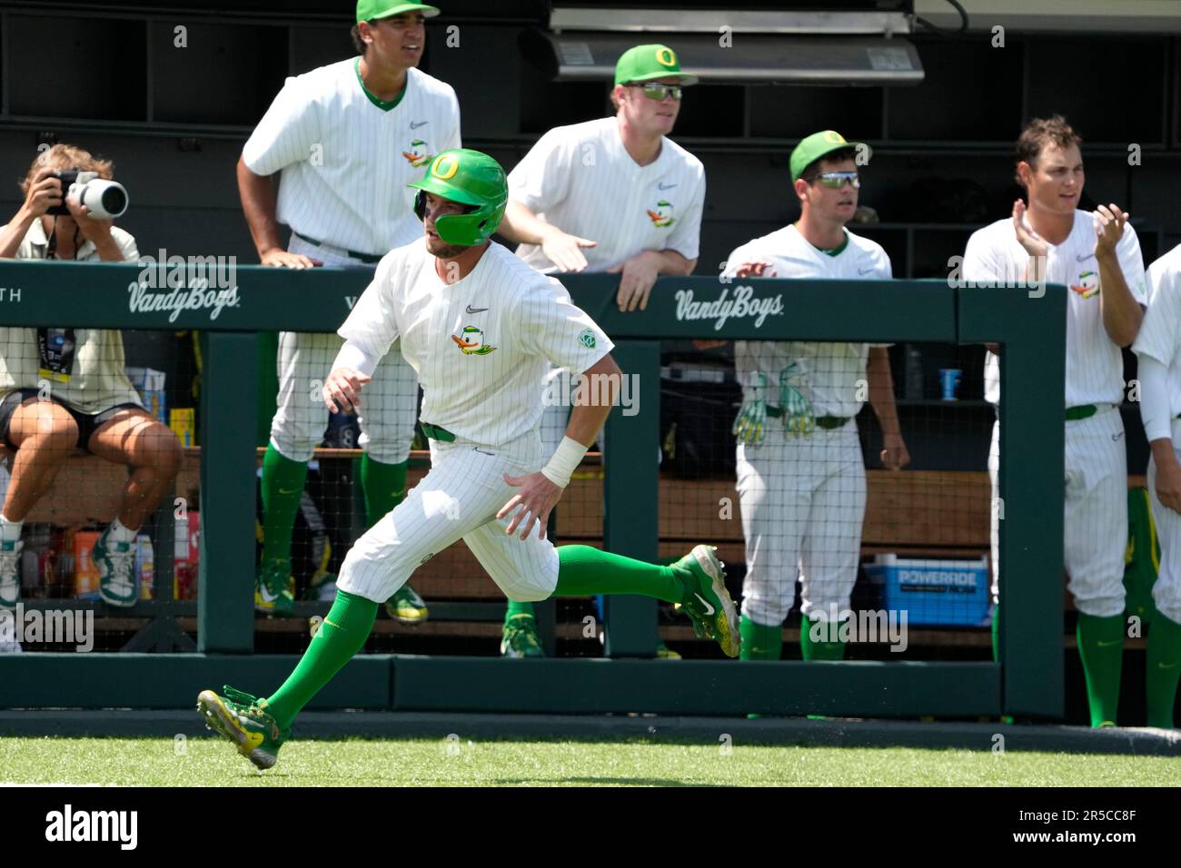 Oregon's Colby Shade scores from second on a double by Drew Cowley in