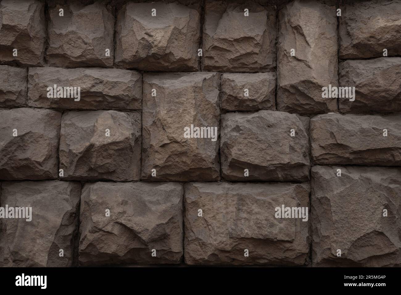 Une photo de mur en pierre brune, un arrière-plan, une texture Banque D'Images